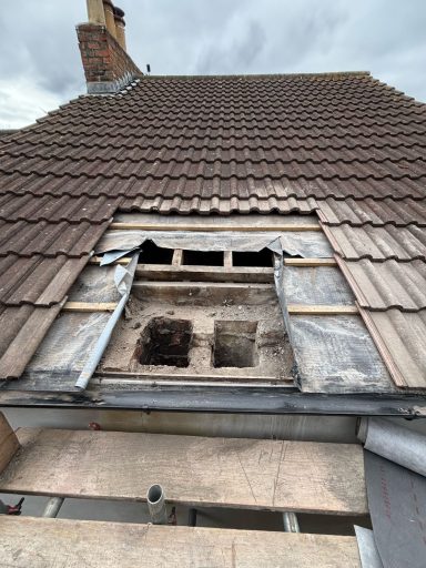 Roof stripped back for a new chimney and flue penetration