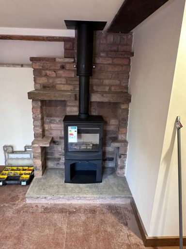 Stone chimney breast install with twin-wall flue and slate hearth